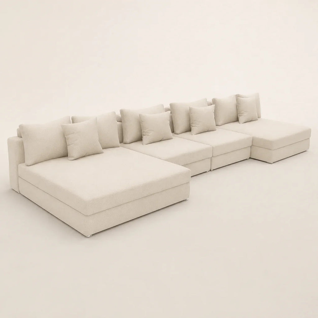 Luxury beige sectional sofa with chaise lounges and plush cushions, ideal for modern living rooms