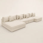 Luxury beige sectional sofa with chaise lounges and plush cushions, ideal for modern living rooms