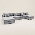 Luxury grey velvet sectional sofa with chaise lounges and matching cushions, ideal for modern living rooms