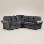 Luxury dark grey velvet corner sofa with tufted arms and nailhead trim, ideal for modern living rooms