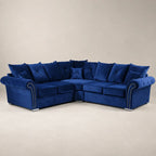 Luxury navy blue velvet sectional sofa with tufted cushions and nailhead trim, perfect for modern living rooms