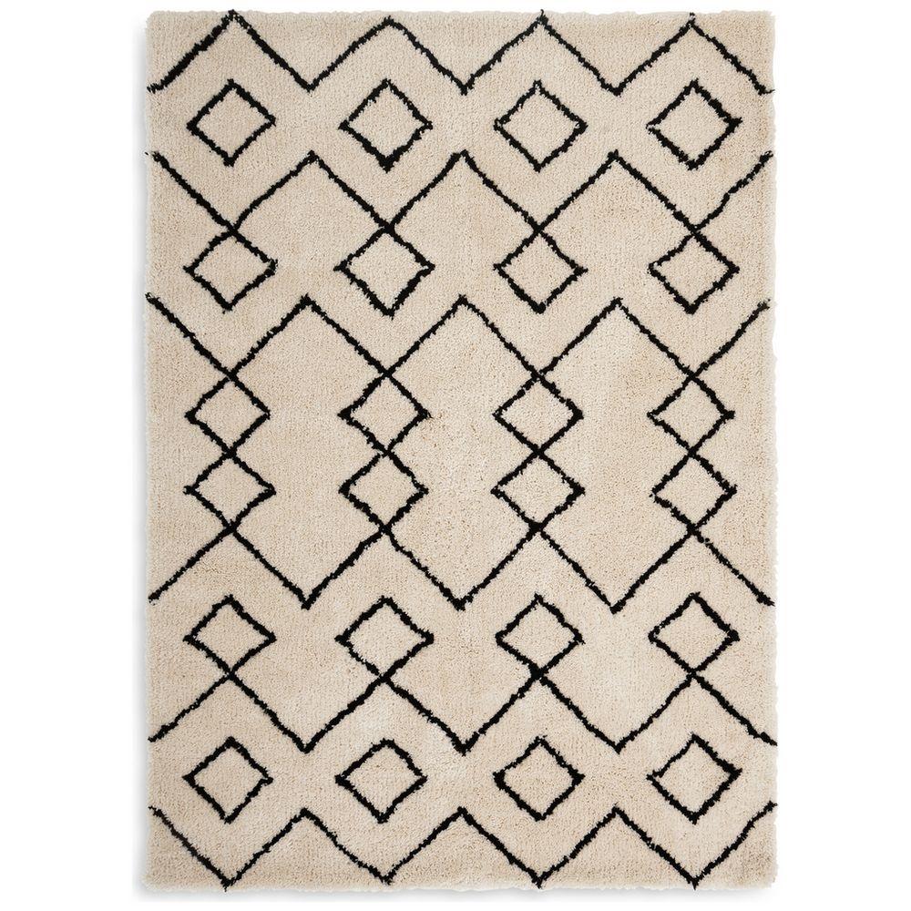 Cream shaggy rug with black geometric diamond pattern, luxury home decor