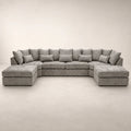 Luxury grey sectional sofa with chaise lounges and plush cushions, perfect for modern living rooms.