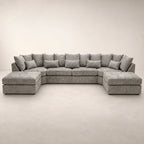 Luxury grey sectional sofa with chaise lounges and plush cushions, perfect for modern living rooms.