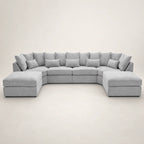 Luxury grey sectional sofa with chaise lounges and plush cushions, perfect for modern living rooms.