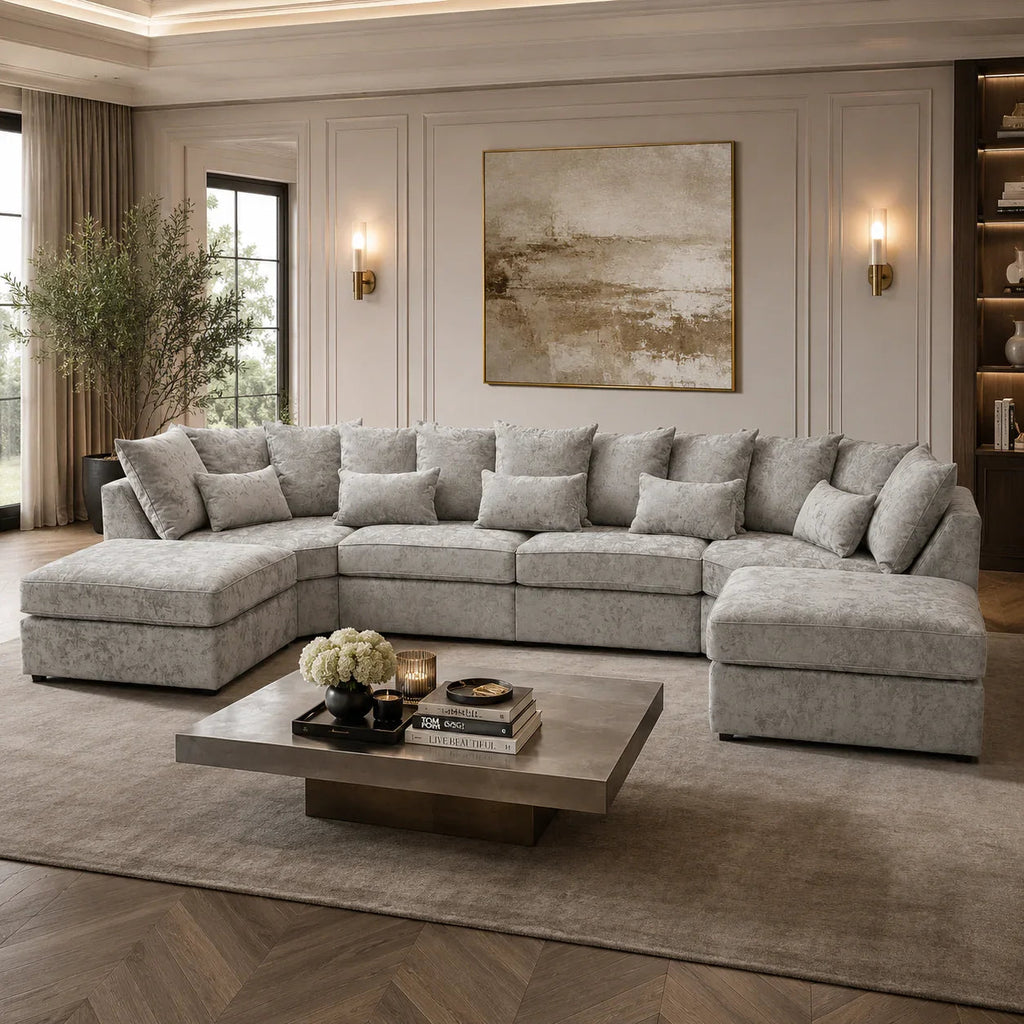 Luxury grey sectional sofa with chaise lounges in elegant living room, perfect for modern home interiors.