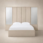 Luxury beige upholstered bed with mirrored panels and white linens, modern bedroom furniture