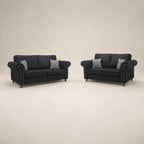 Black fabric sofas with rolled arms and plaid cushions, luxury living room furniture