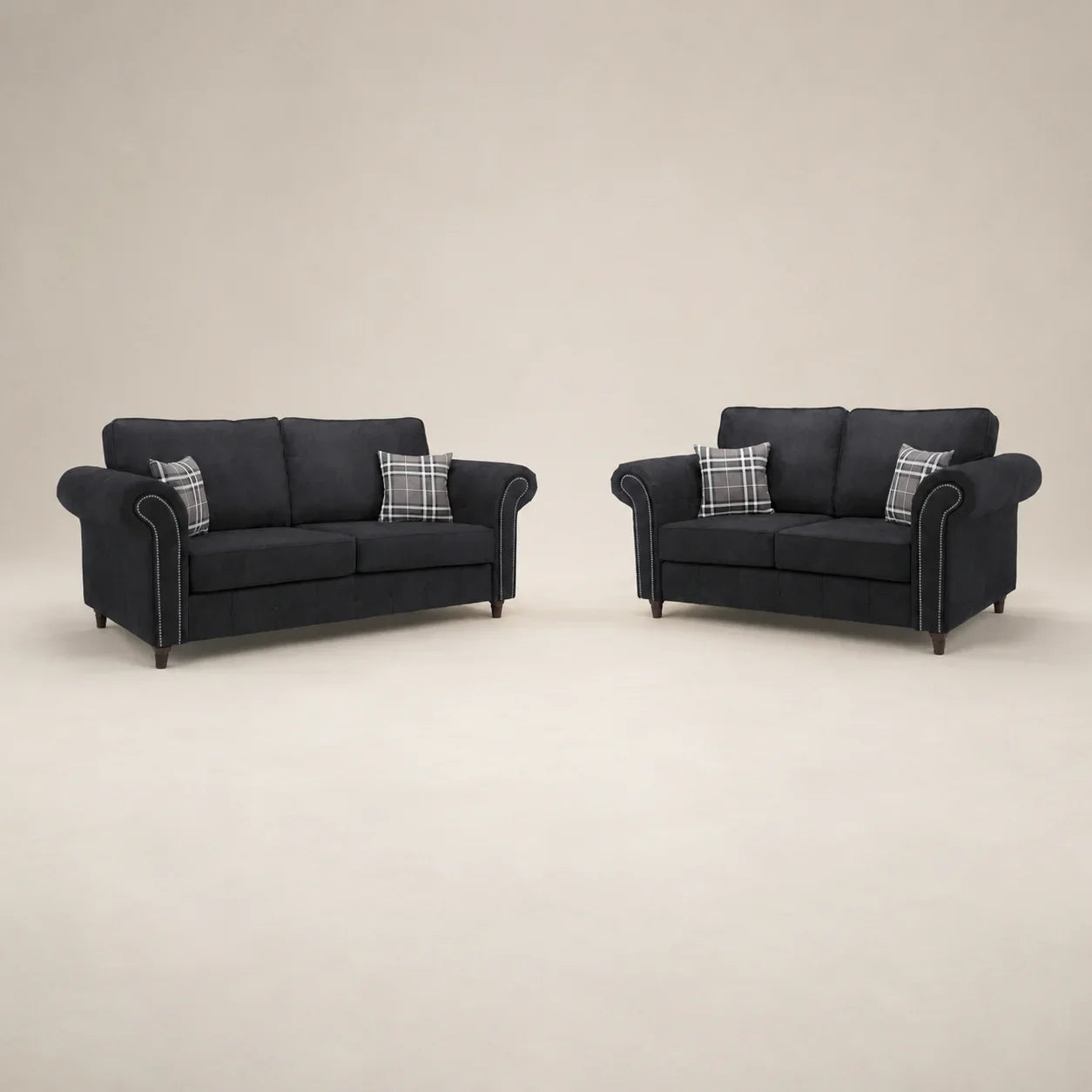 Black fabric sofas with rolled arms and plaid cushions, luxury living room furniture