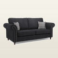 Black fabric sofa with rolled arms, nailhead trim, and plaid pillows for living room comfort