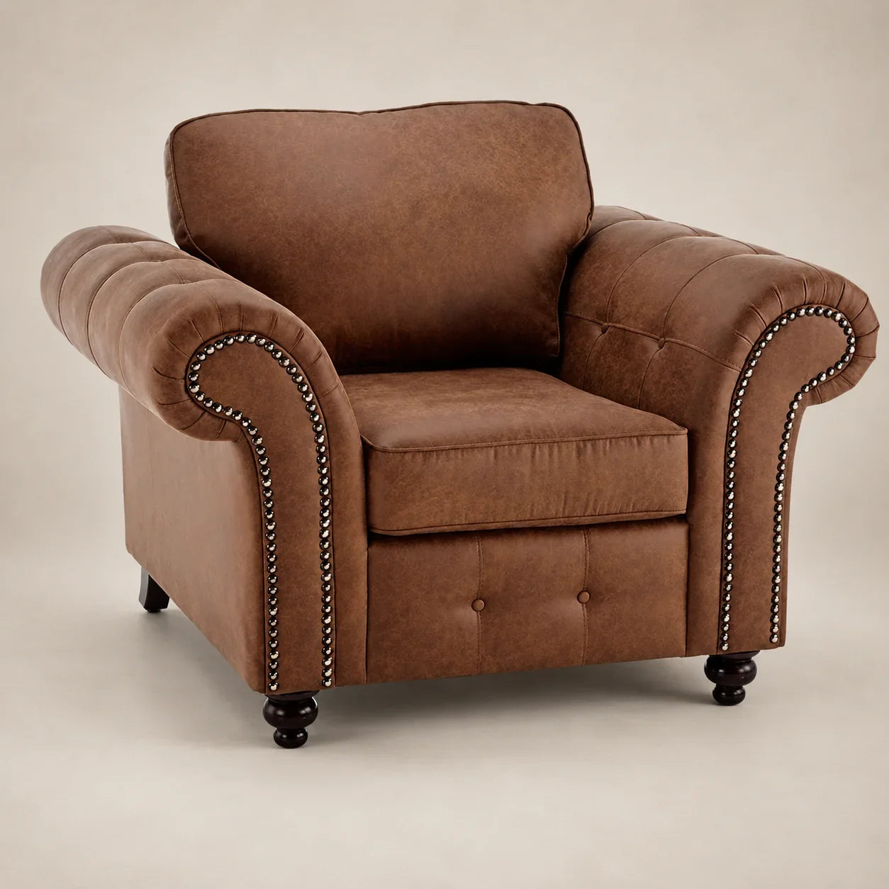 Brown leather armchair with nailhead trim, tufted back, and rolled arms for luxury living room seating