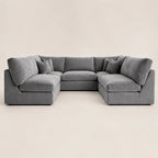 Gray velvet sectional sofa with chaise lounges and plush cushions, modern luxury living room furniture