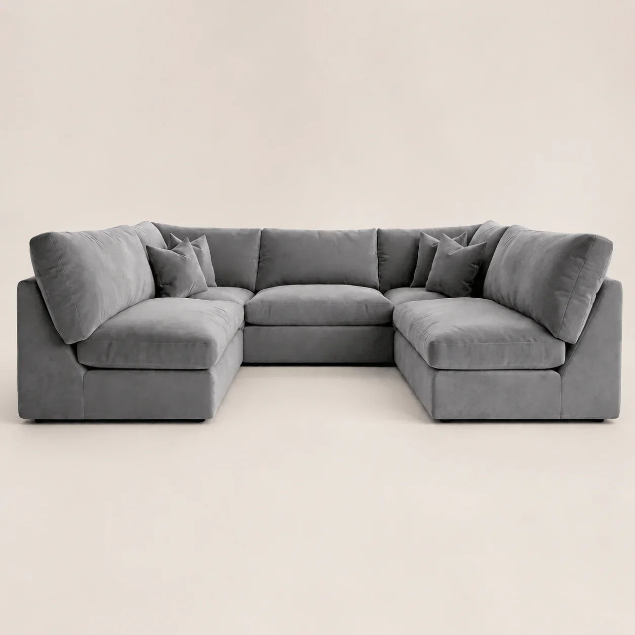 Gray velvet sectional sofa with chaise lounges and plush cushions, modern luxury living room furniture