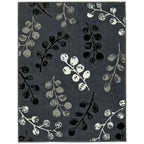 Gray area rug with black and white berry branch pattern for modern living room decor