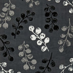 Dark grey fabric with black, white, and grey berry branch pattern for luxury sofas and beds