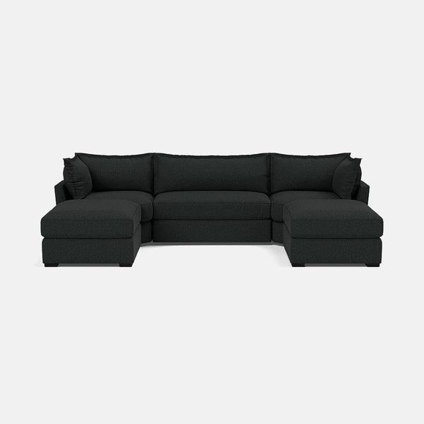 Modern dark grey U-shaped sectional sofa with generous cushions on a plain background