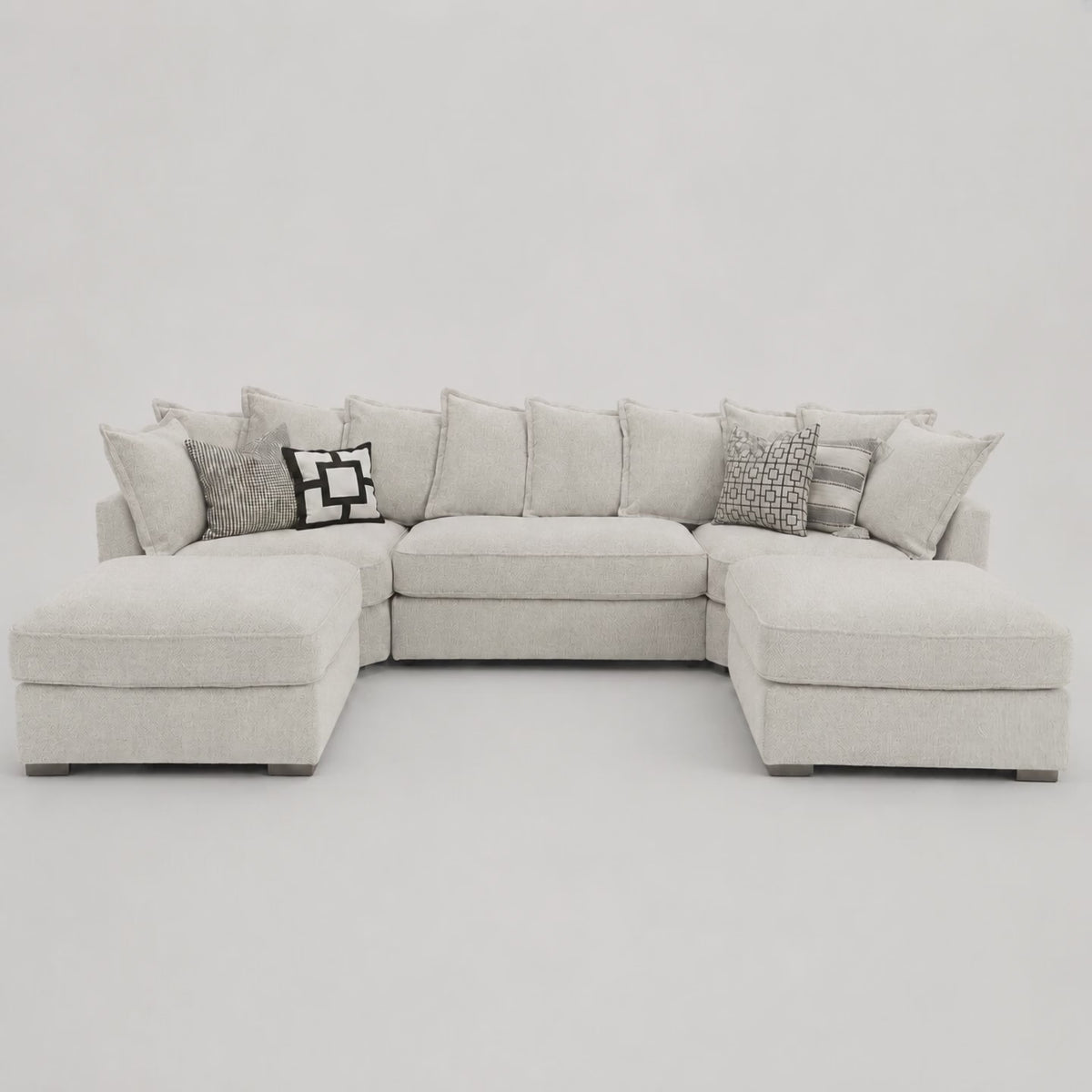 Primrose U Shape Sofa in Crimsy Truffle — frontal studio demonstration with seated model for scale