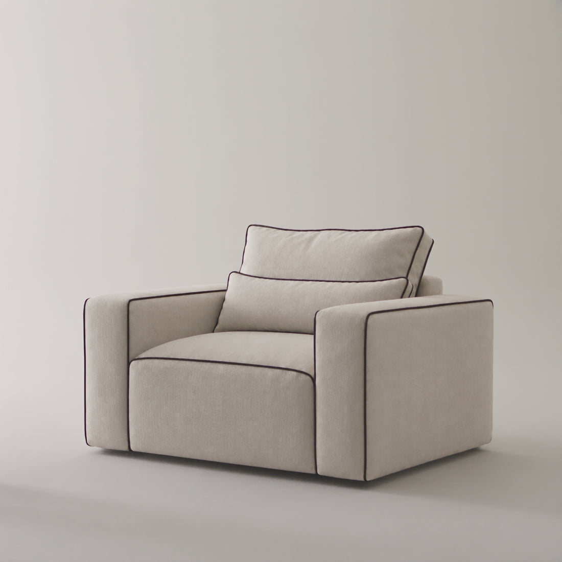 Maison Armchair in a minimal studio with an adult model demonstrating scale