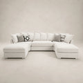 Luxury white sectional sofa with chaise lounges and patterned throw pillows, perfect for modern living rooms.