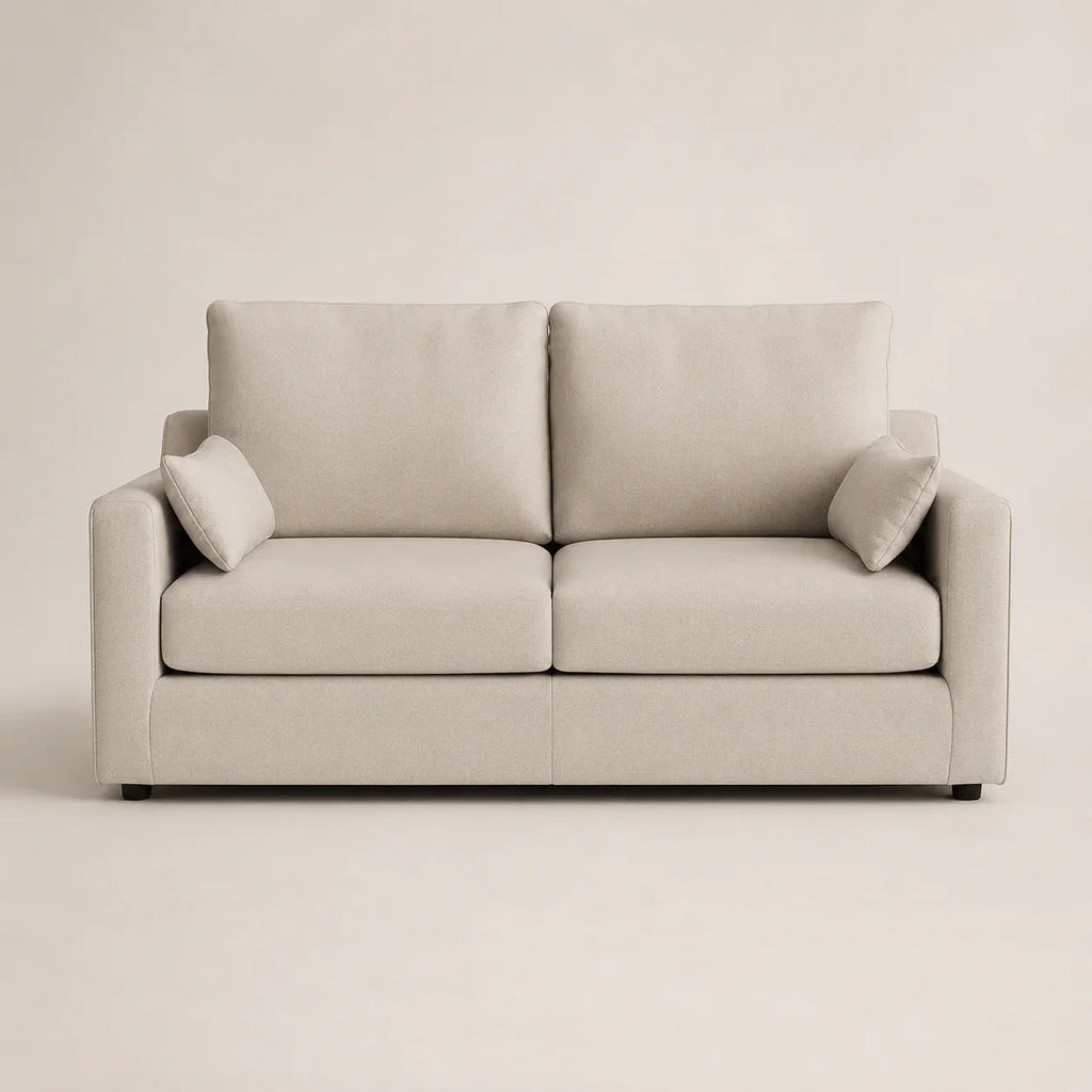 Beige two-seater sofa with plush cushions and modern design for luxury living rooms