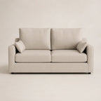 Beige two-seater sofa with plush cushions and modern design for luxury living rooms