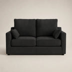 Black two-seater sofa with plush cushions, modern living room furniture
