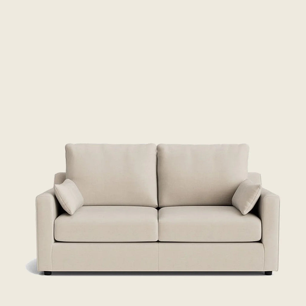 Beige two-seater sofa with matching cushions, ideal for modern living rooms