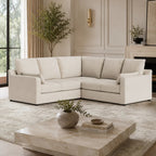 Luxury beige sectional sofa in modern living room with marble coffee table and greenery