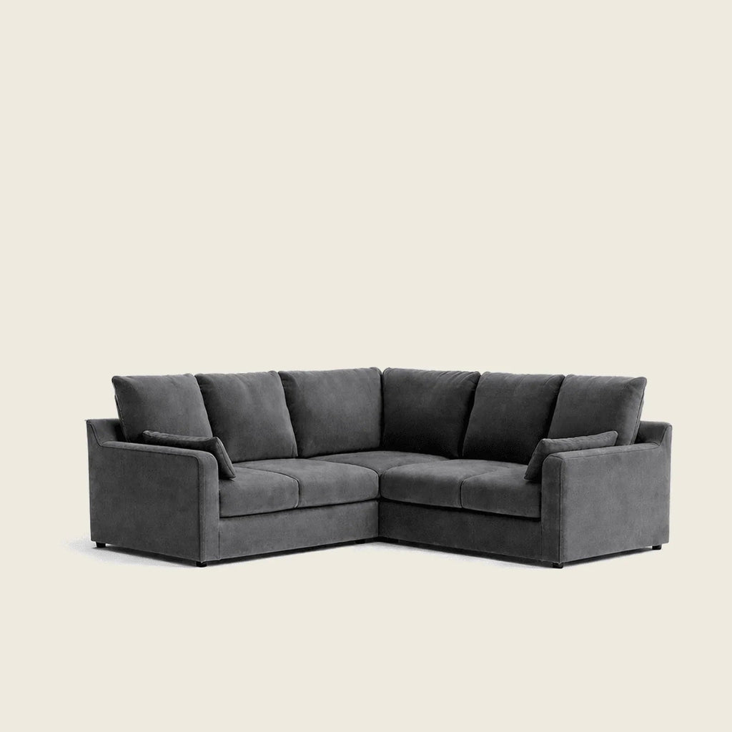 Dark gray L-shaped sectional sofa with plush cushions, modern luxury living room furniture