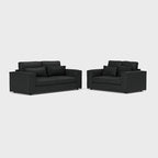 Modern black 3-seater and 2-seater sofa set with matching cushions on white background
