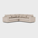 Modern beige double corner sofa with clean lines and plush back cushions on white background