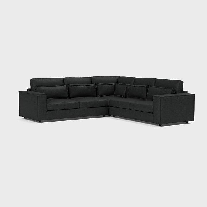 Modern dark grey double corner sofa with plush cushions, ideal for contemporary living rooms.