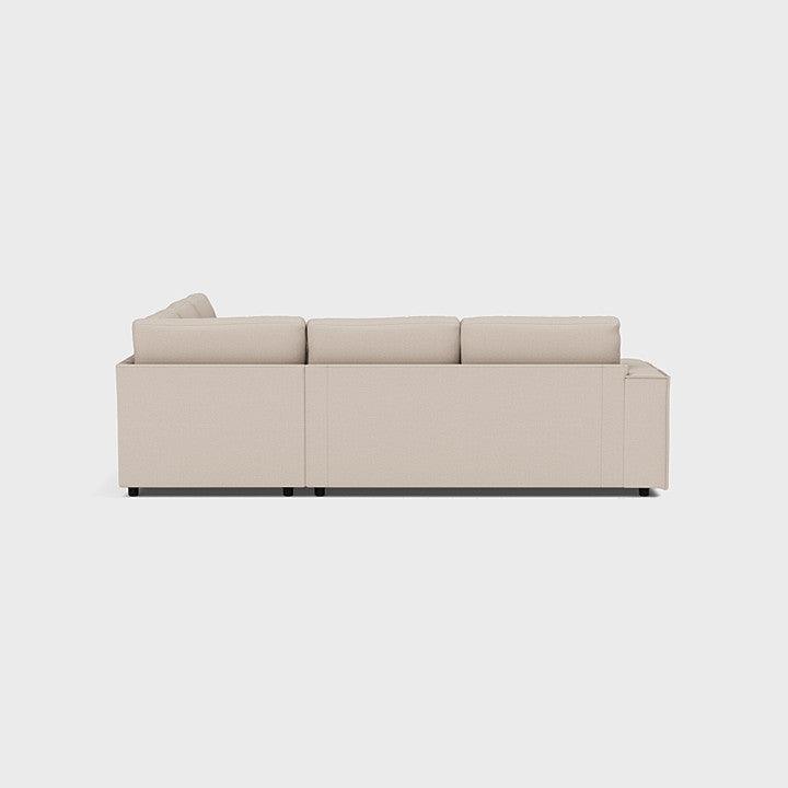 Modern beige double corner sofa with clean lines, shown from the back on a white background