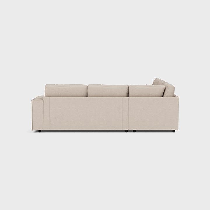 Modern beige double corner sofa with clean lines and plush cushions, side profile view
