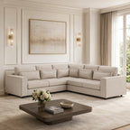 Luxury beige sectional sofa in elegant living room with modern art and gold sconces