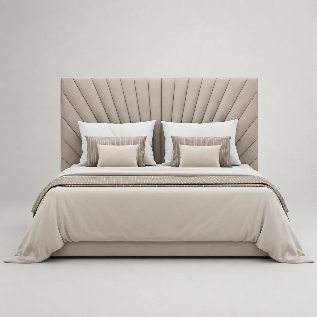 Luxury upholstered bed with tufted headboard, neutral bedding, and striped accent pillows