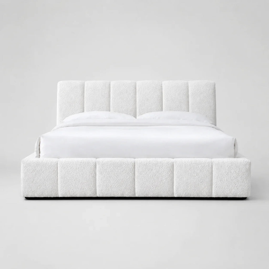White luxury upholstered bed with tufted headboard and base, modern bedroom furniture