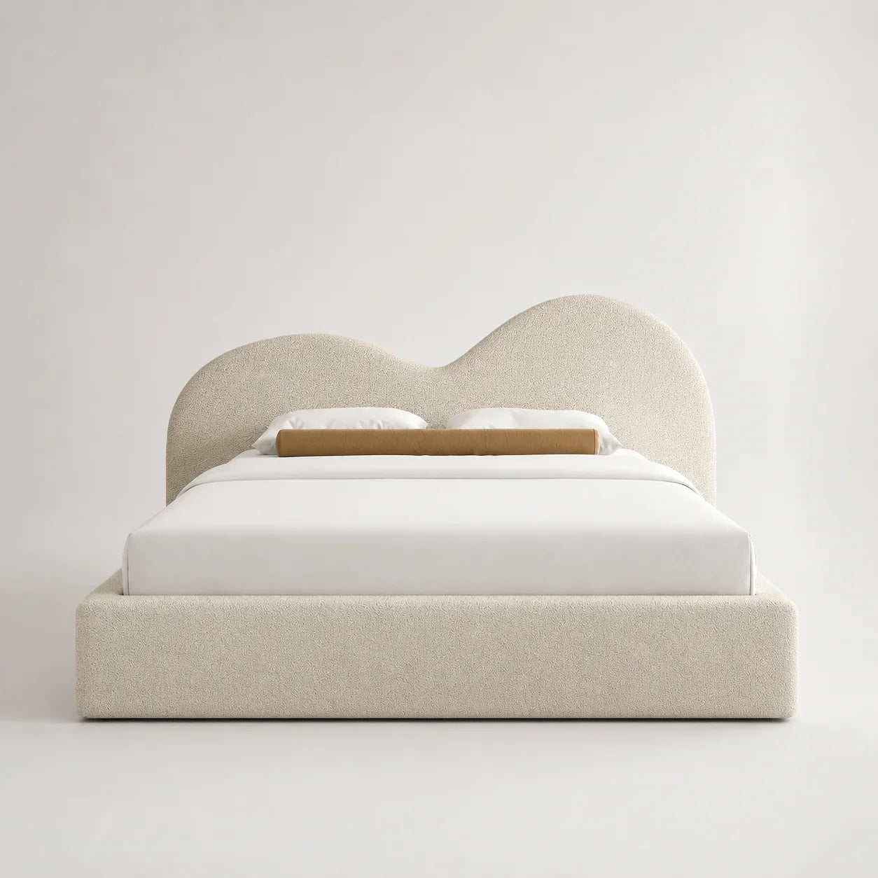 Luxury upholstered bed with curved headboard, white bedding, and beige textured fabric