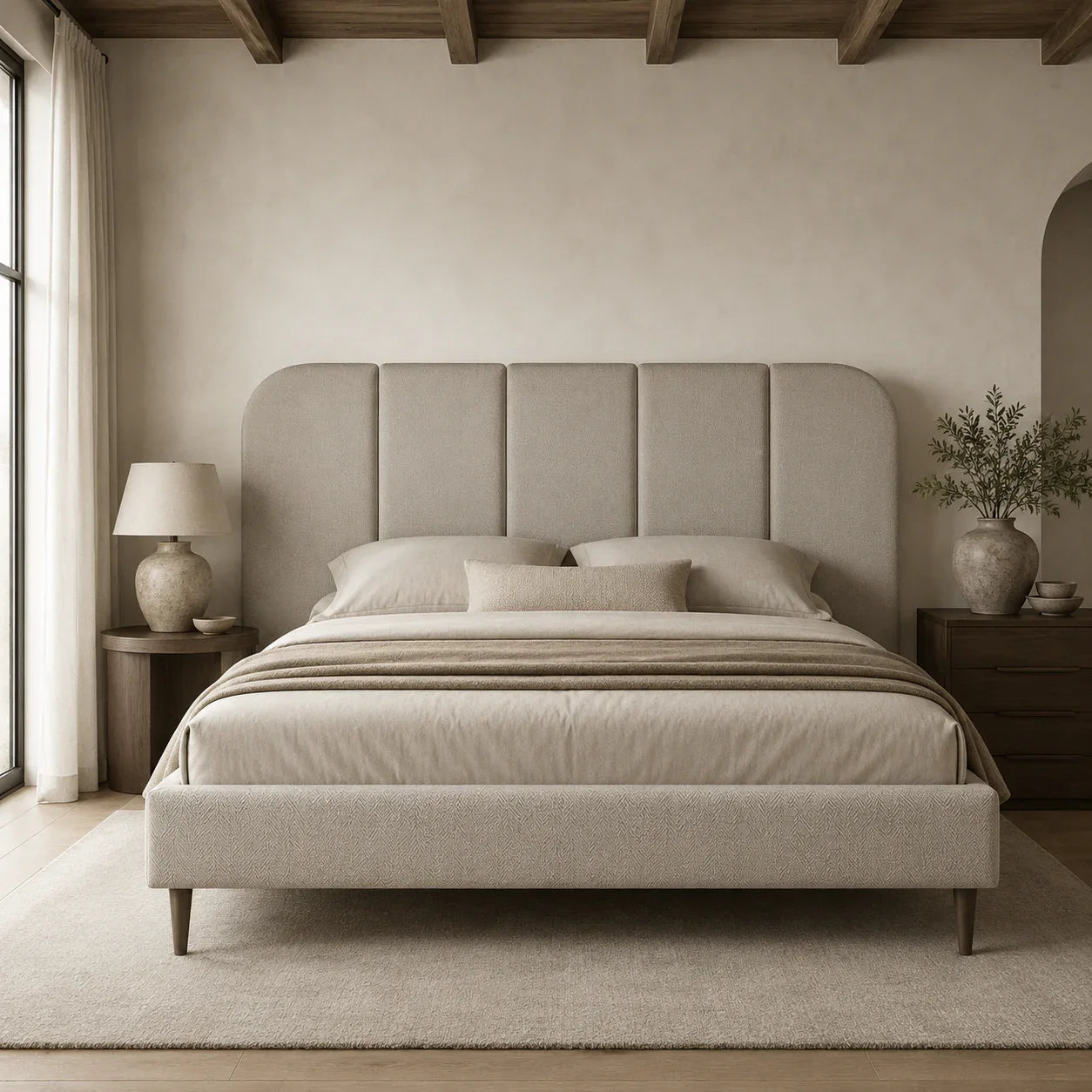 Luxury upholstered bed with tufted headboard in neutral tones, styled in modern bedroom with wooden beams