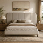 Luxury upholstered bed with tufted headboard in neutral tones, styled with bedding and bedside tables for modern bedroom