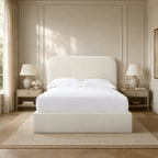 Luxury upholstered bed with white linens in elegant bedroom, featuring panelled walls and matching nightstands