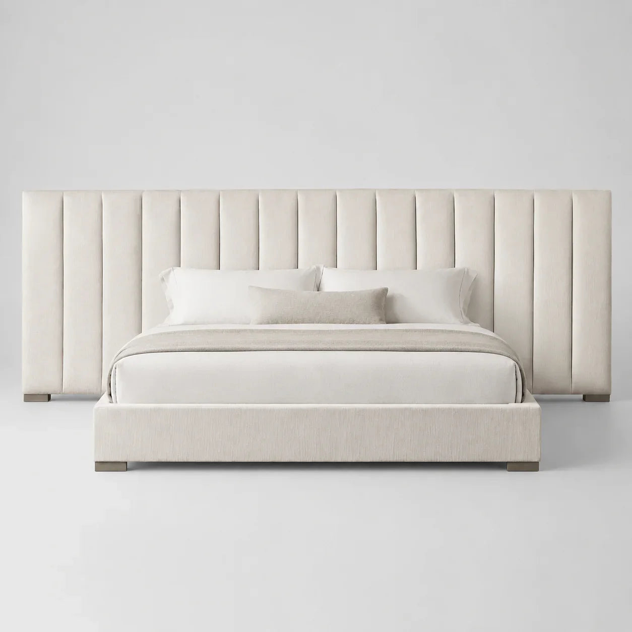 Luxury upholstered bed with tall panel headboard, neutral bedding, modern bedroom furniture