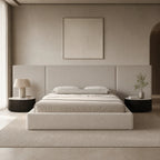 Luxury upholstered bed with modern headboard in neutral tones, styled in minimalist bedroom with side tables and art