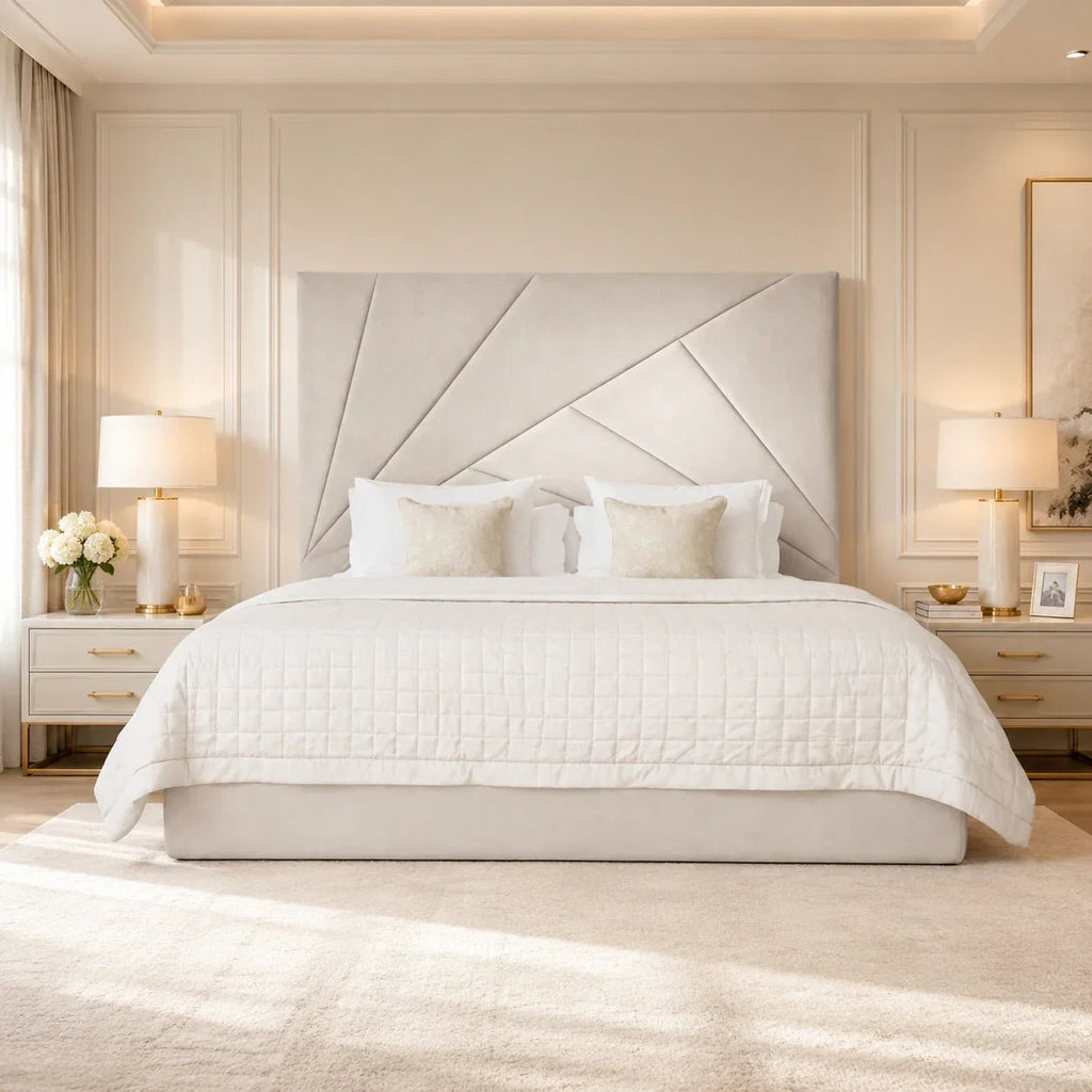 Luxury upholstered bed with geometric headboard, white quilted bedding, and matching nightstands in elegant bedroom