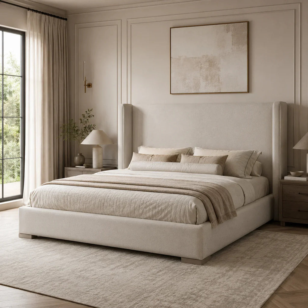 Luxury upholstered bed with tall headboard in neutral tones, styled in modern bedroom with natural light