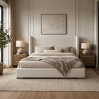 Luxury upholstered bed with neutral bedding, wooden nightstands, and modern bedside lamps in a serene bedroom
