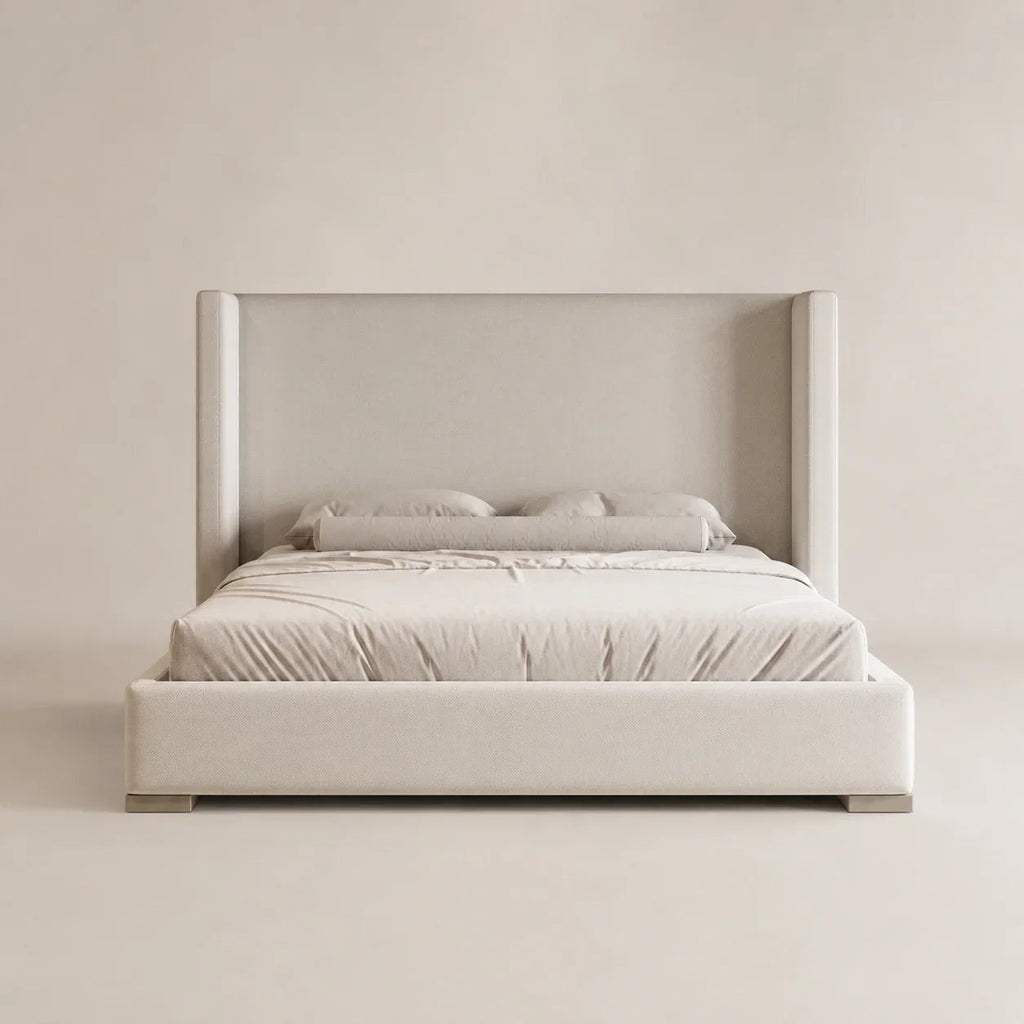 Luxury upholstered bed with wingback headboard, neutral tones, modern bedroom furniture