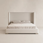 Luxury upholstered bed with wingback headboard, neutral tones, modern bedroom furniture