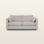 Luxury beige two-seater sofa with plush cushions, modern design for living room comfort