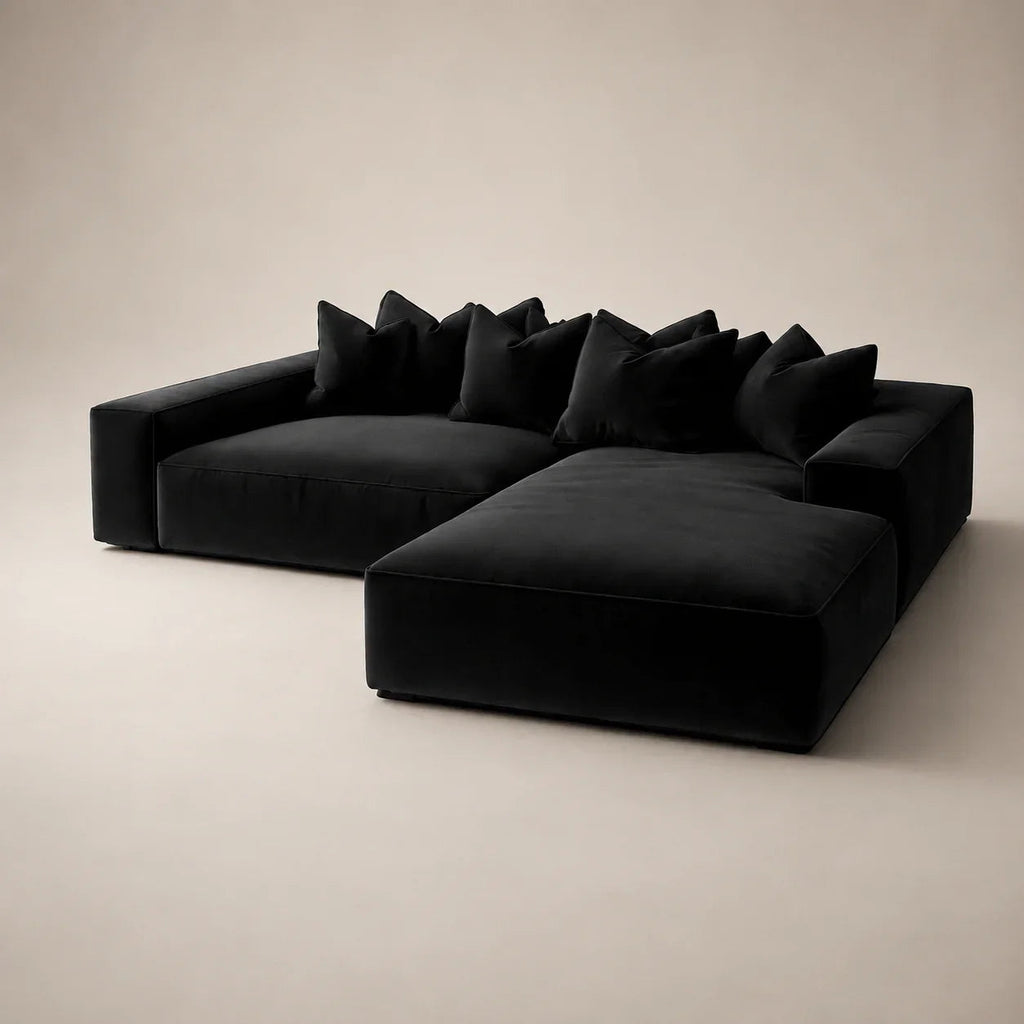 Luxury black velvet sectional sofa with plush cushions, modern minimalist design for contemporary living rooms